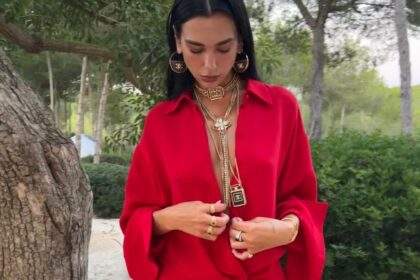 Dua Lipa Layers Her Plunging Red Birthday Gown With Tons of Gold Chanel Necklaces